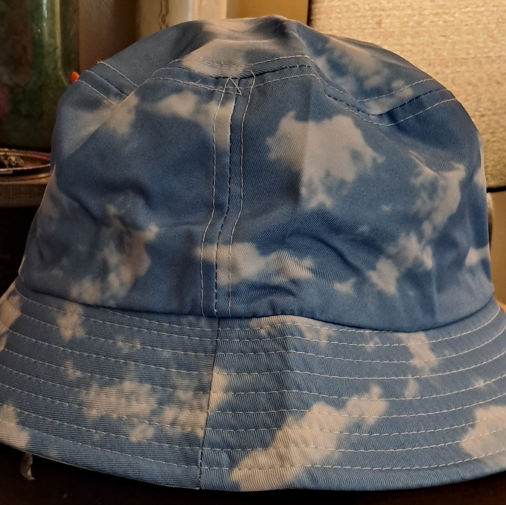 Blue bucket hat with white clouds